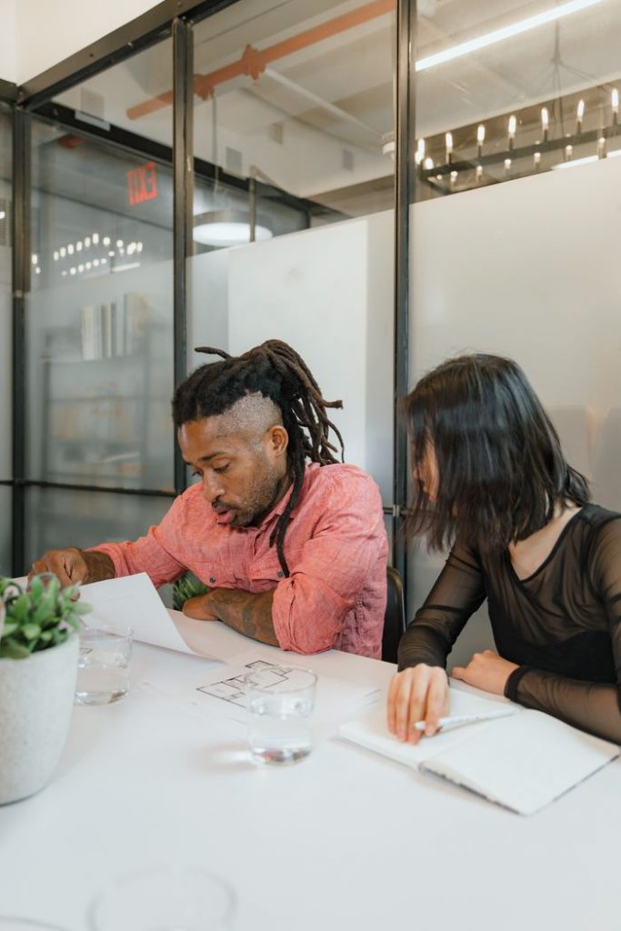 Mastering the First Impression: Your intriguing post title goes here A diverse team of two professionals working on a project in a modern office setting.